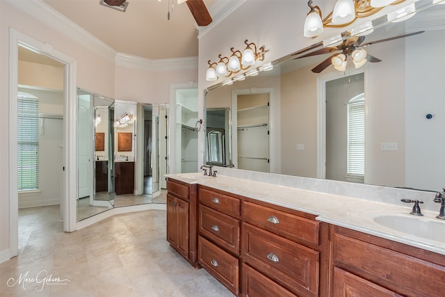 bathroom with ceiling fan, ornamental molding, and vanity