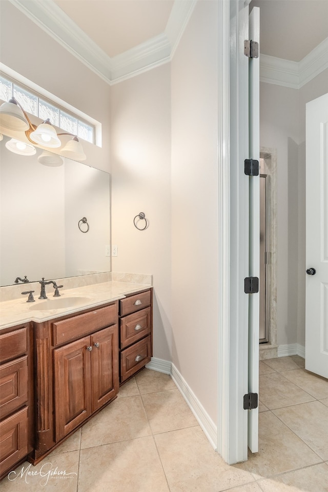 bathroom with tile patterned floors, vanity, and ornamental molding