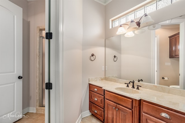 9356 Dogwood Trl, Haughton, LA 71037 - bathroom featuring baseboards, tile patterned floors, vanity, and a notable chandelier