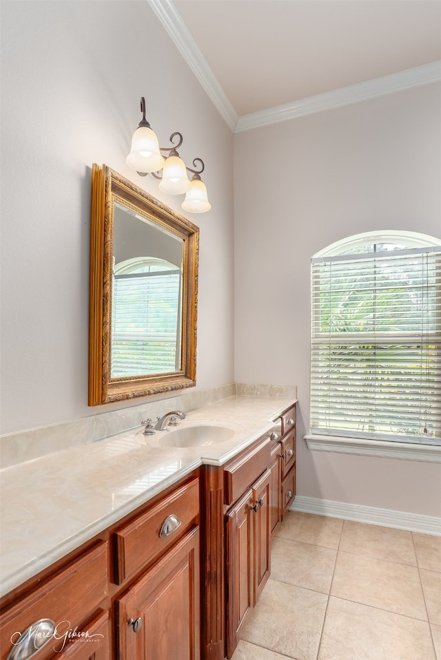 bathroom featuring vanity, crown molding, and tile patterned flooring