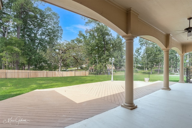 exterior space featuring a lawn and ceiling fan