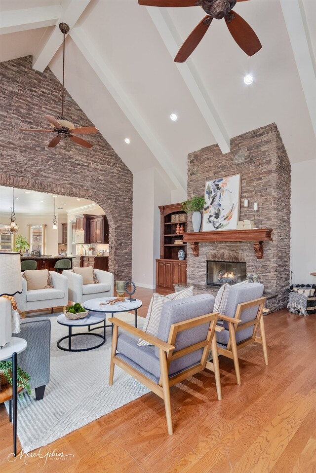 9356 Dogwood Trl, Haughton, LA 71037 - living area with light wood-type flooring, arched walkways, high vaulted ceiling, and ceiling fan
