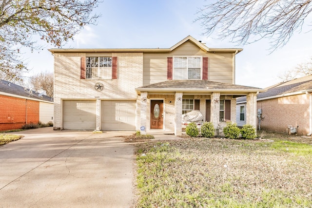 front of property with a porch and a garage