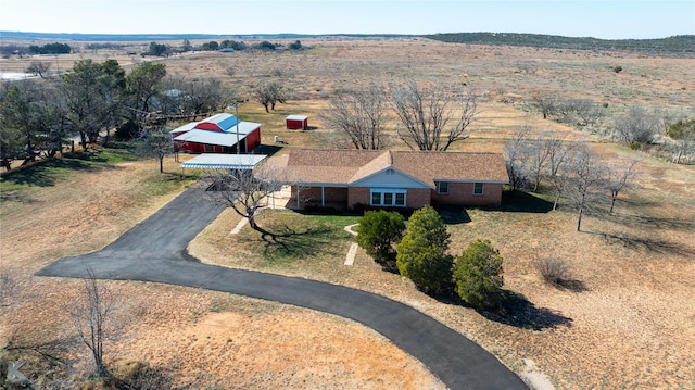 birds eye view of property featuring a rural view