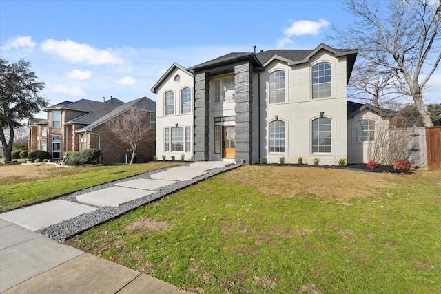 view of property featuring a front lawn