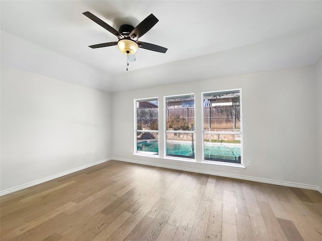 empty room featuring ceiling fan and light wood-type flooring