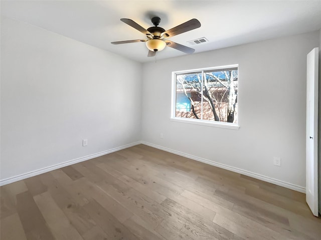 spare room featuring ceiling fan and wood-type flooring