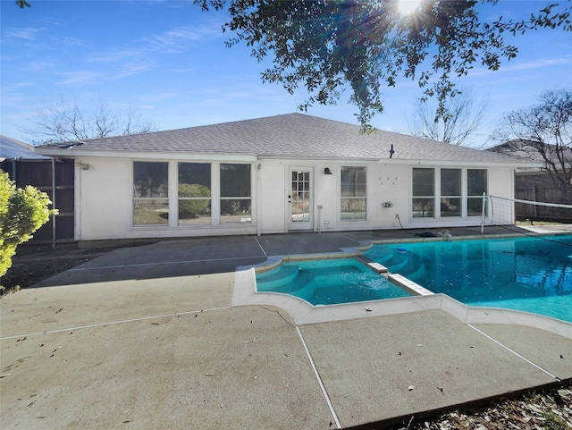 view of pool with an in ground hot tub and a patio