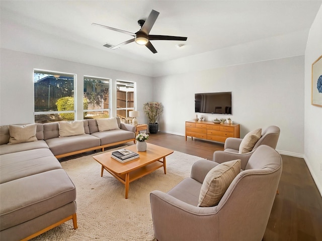 living room with hardwood / wood-style flooring and ceiling fan