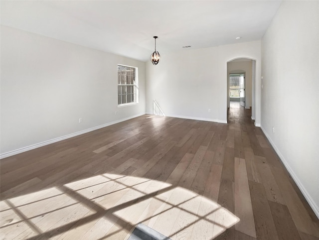 unfurnished room with dark hardwood / wood-style floors