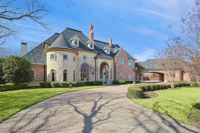 french country home with a front yard