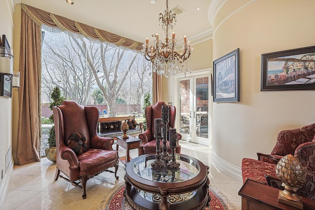 sitting room with an inviting chandelier, light tile patterned floors, and crown molding