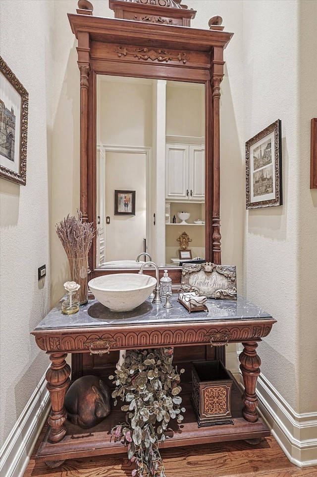 bathroom with hardwood / wood-style floors and vanity