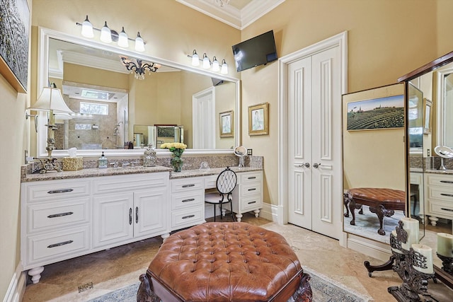 full bathroom featuring a shower, ornamental molding, vanity, and baseboards