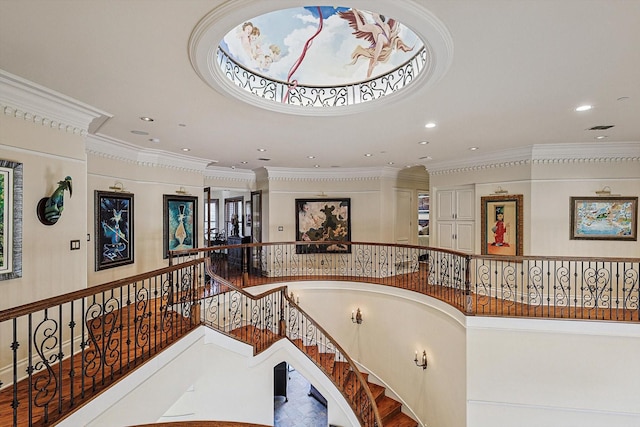 stairs featuring crown molding and a towering ceiling