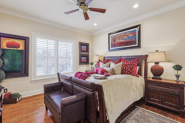 bedroom featuring ceiling fan, recessed lighting, wood finished floors, baseboards, and ornamental molding