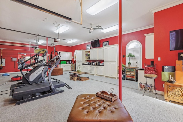 workout area with a garage, visible vents, crown molding, and baseboards