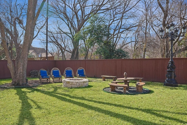 view of yard featuring an outdoor fire pit