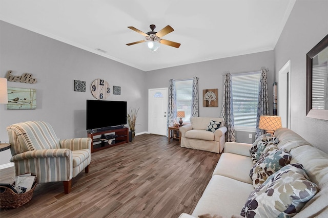 living room with ceiling fan, ornamental molding, and hardwood / wood-style floors