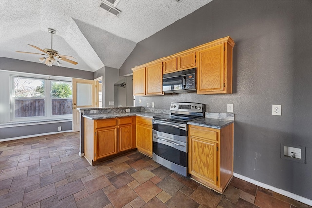 kitchen featuring kitchen peninsula, ceiling fan, range with two ovens, lofted ceiling, and a textured ceiling