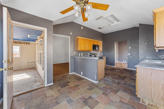 kitchen featuring ceiling fan, stainless steel electric stove, light brown cabinetry, and sink