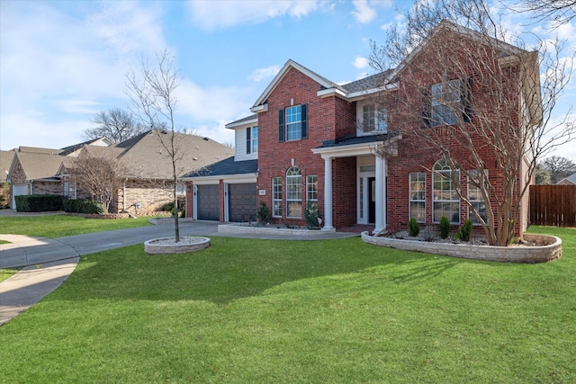 view of front of house with a front yard and a garage