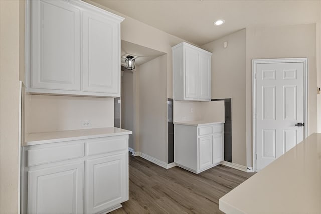 kitchen featuring light hardwood / wood-style floors and white cabinets