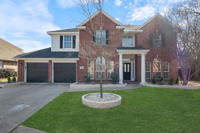 front of property with a front lawn and a garage