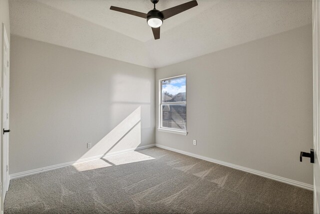 empty room with ceiling fan and carpet flooring