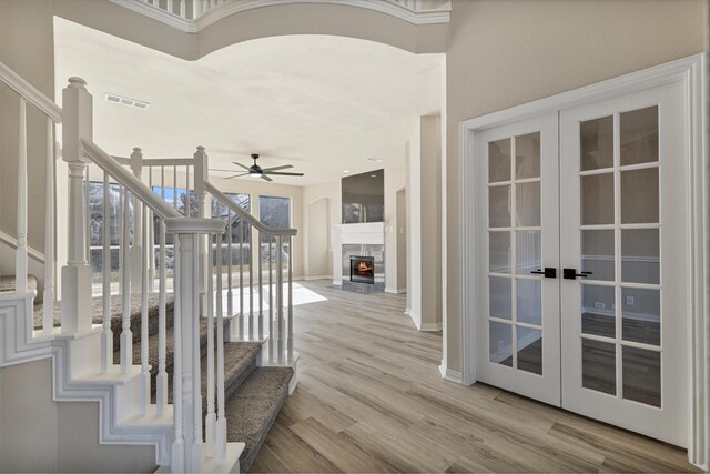 unfurnished dining area with ornamental molding, a chandelier, and light hardwood / wood-style floors