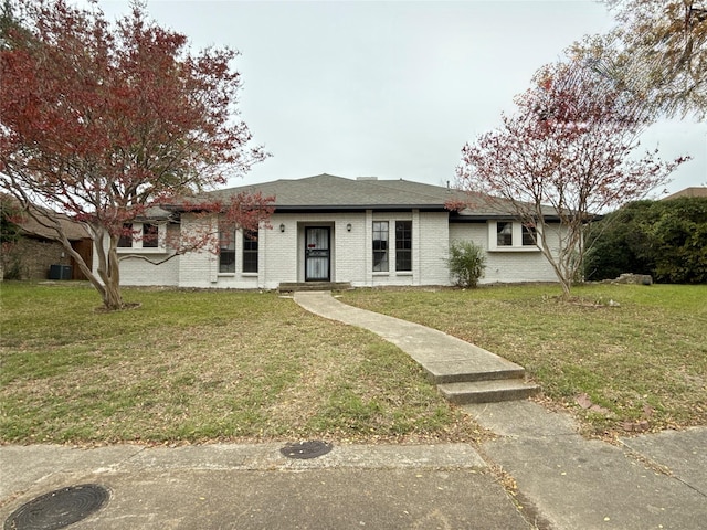 ranch-style home with a front lawn