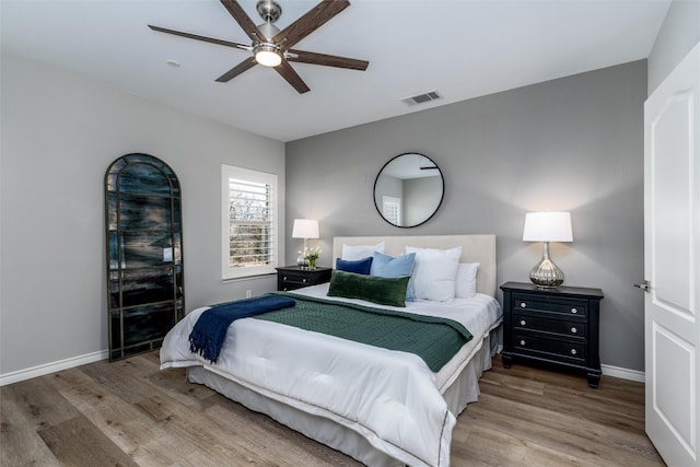 bedroom featuring ceiling fan and hardwood / wood-style floors