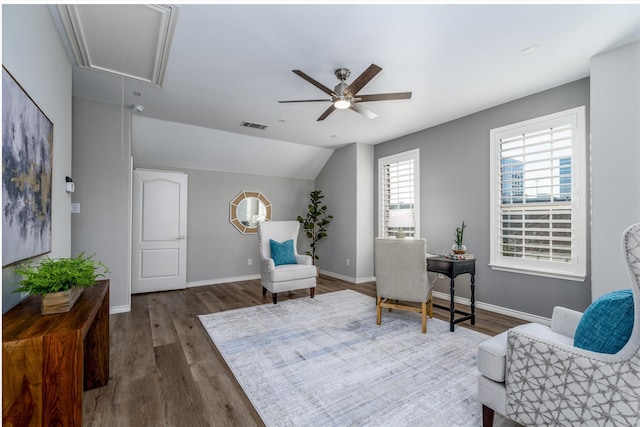 sitting room with ceiling fan, dark hardwood / wood-style floors, and lofted ceiling