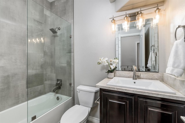 full bathroom featuring toilet, enclosed tub / shower combo, and vanity