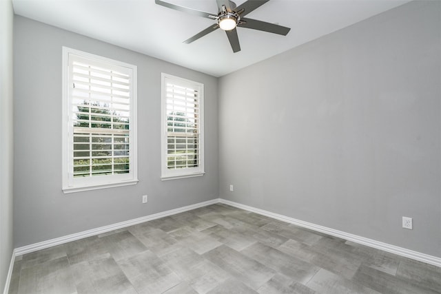 unfurnished room with ceiling fan