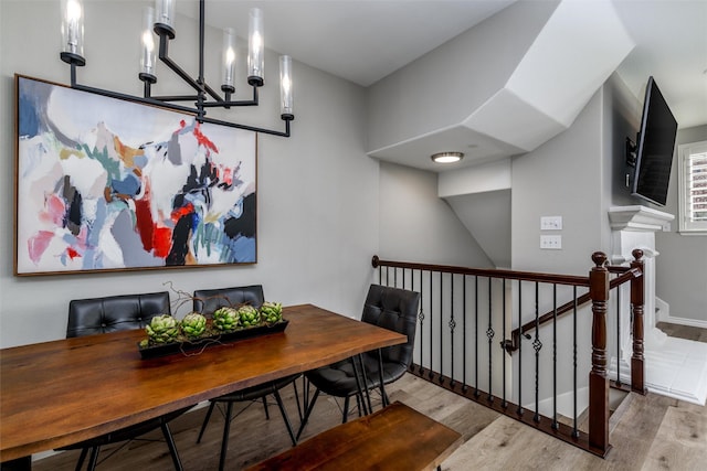 interior space with a notable chandelier and light hardwood / wood-style floors