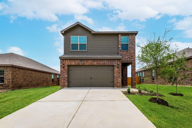 view of front facade featuring a garage and a front lawn