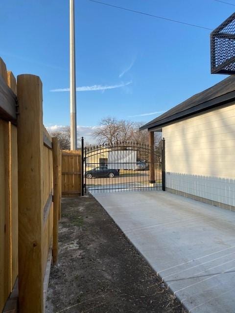 view of gate with fence