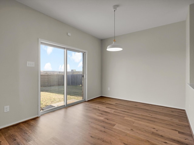 spare room featuring hardwood / wood-style flooring