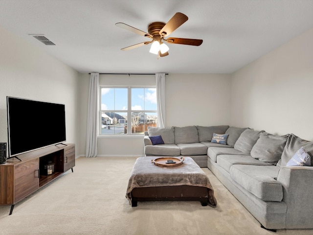 living room with light carpet and ceiling fan