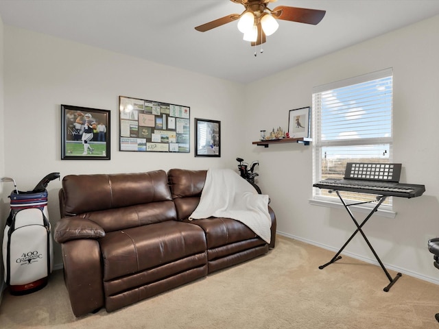 living room featuring light carpet and ceiling fan