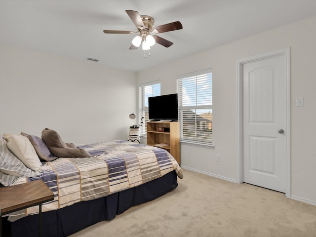 bedroom featuring ceiling fan and light colored carpet