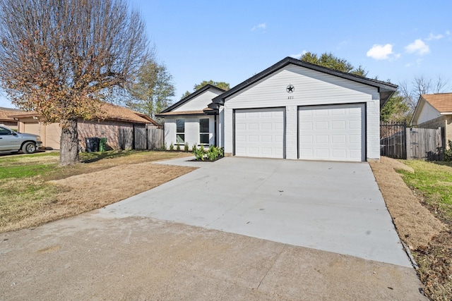 single story home featuring a front lawn