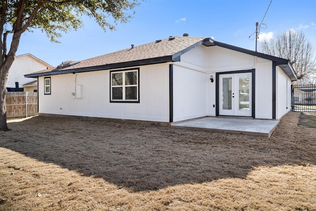 back of property featuring french doors and a patio