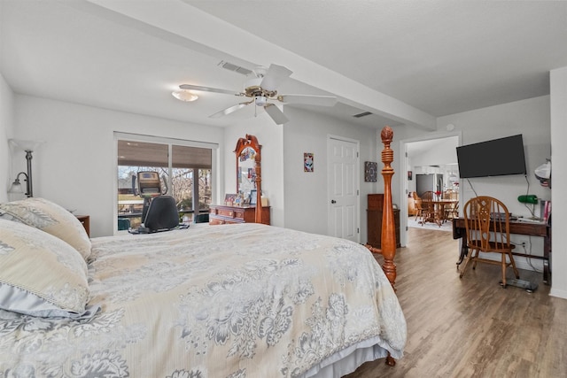 bedroom with ceiling fan, access to outside, stainless steel fridge, and hardwood / wood-style flooring