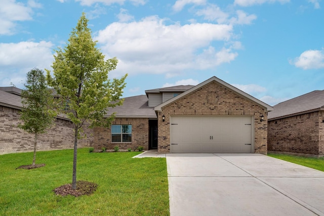 view of front of home featuring a garage and a front lawn