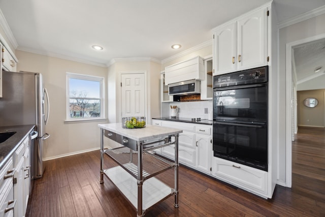 kitchen with black appliances, backsplash, dark hardwood / wood-style flooring, and white cabinetry