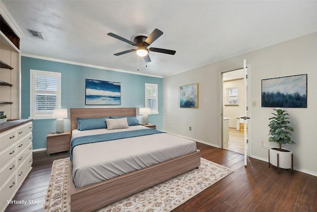 bedroom with ceiling fan, dark wood-type flooring, and ornamental molding