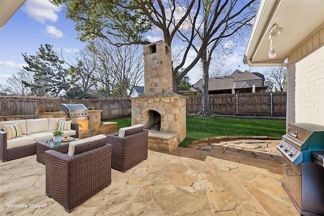 view of patio / terrace with exterior kitchen, an outdoor living space with a fireplace, and a grill