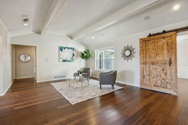 living area with dark wood-type flooring, crown molding, a barn door, and vaulted ceiling with beams